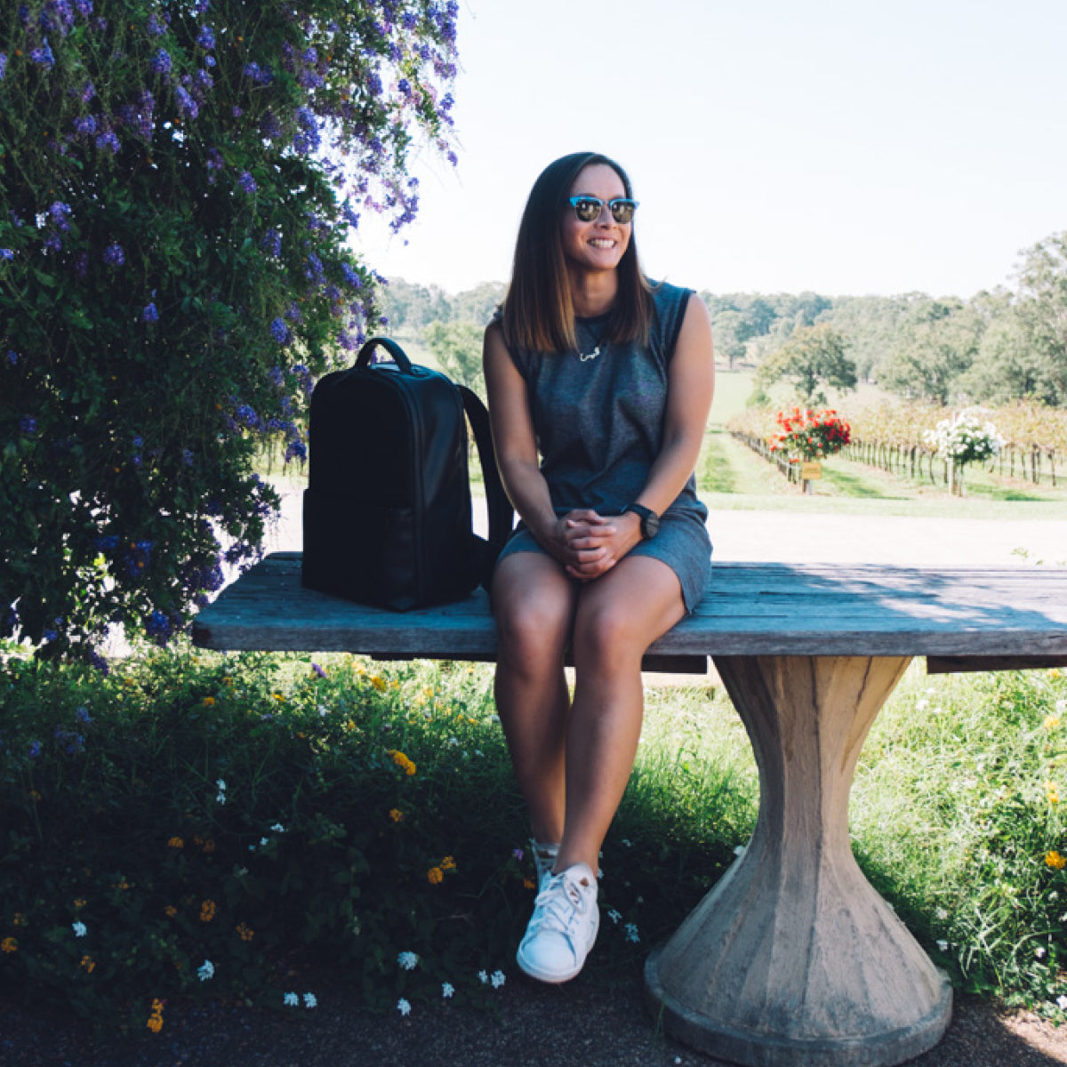 Female with black camera backpack