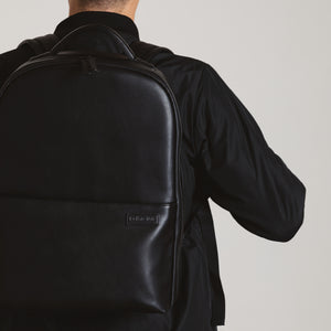 Black camera backpack by No More Ugly